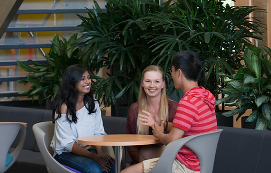 Economics students sit at table
